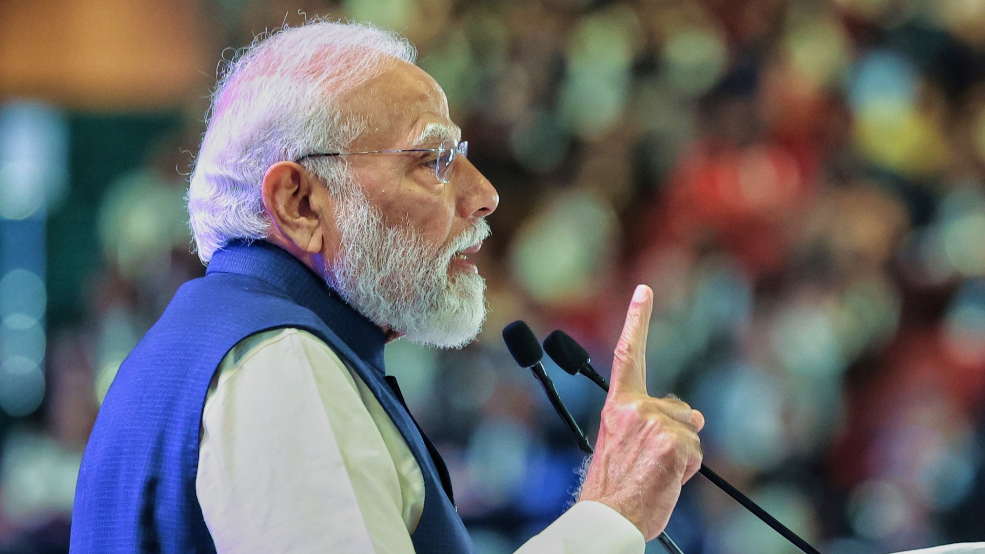 Indian Prime Minister Narendra Modi speaking at a podium, ahead of his first official New Zealand visit in 40 years.